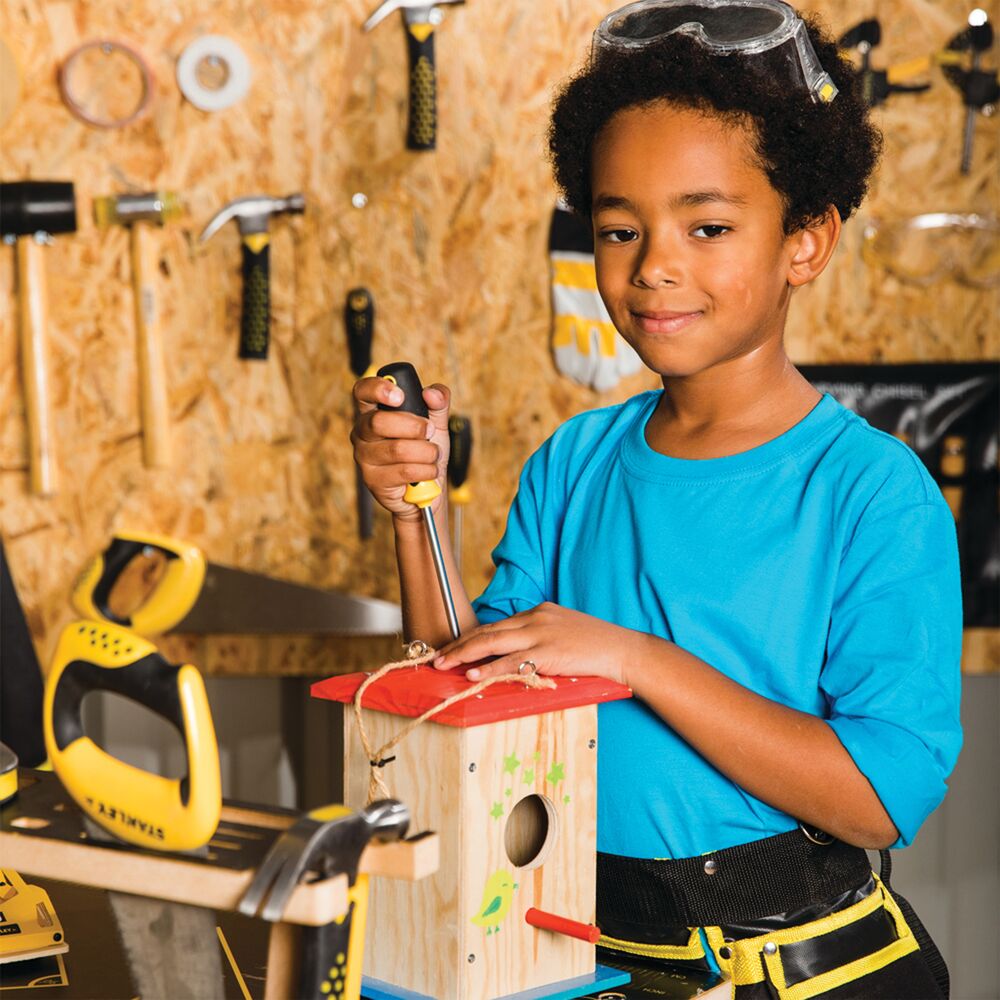 Stanley junior wooden DIY kit birdhouse being used by a kid.
